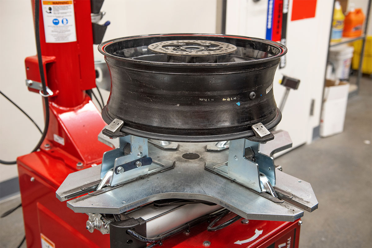 hunter motorcycle wheel service with smartweight pro wheel balancer and tcx table-top tire changer at cycle gear