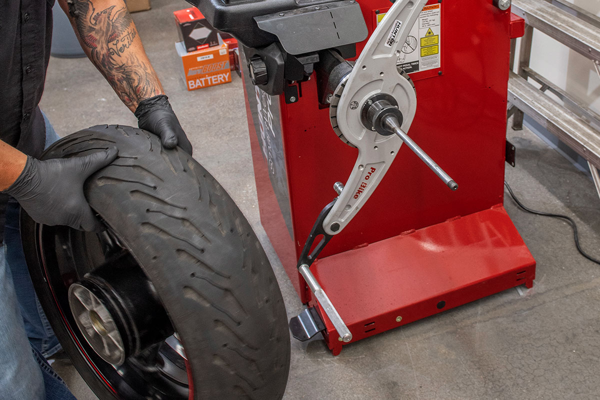 hunter motorcycle wheel service with smartweight pro wheel balancer and tcx table-top tire changer at cycle gear