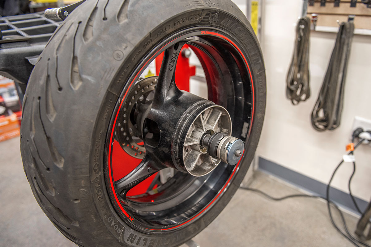 hunter motorcycle wheel service with smartweight pro wheel balancer and tcx table-top tire changer at cycle gear